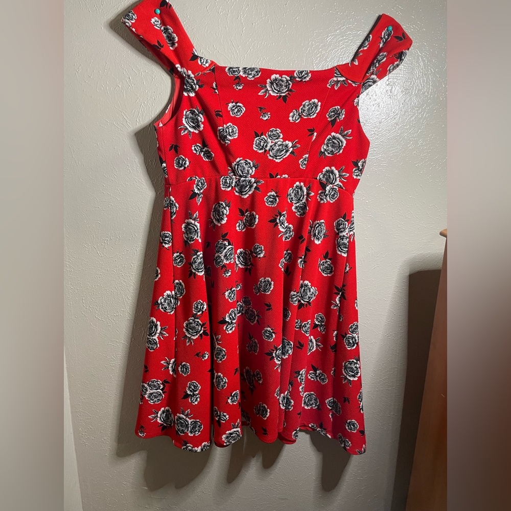 Red off the shoulder dress with black and white roses
